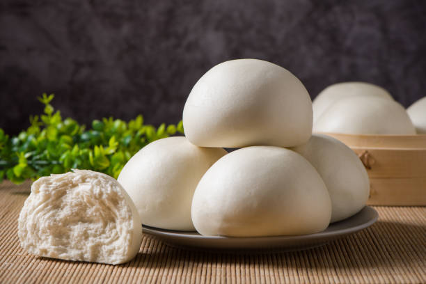 Chinese food steamed buns in plate on table.